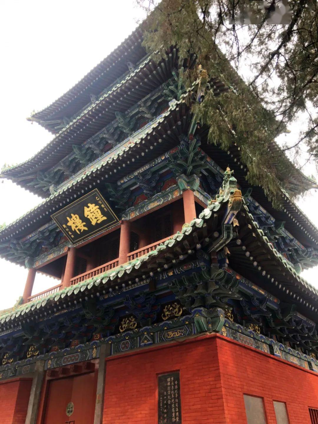 Traditional Chinese temple with ornate roof and red brick walls, Buddhist cultural architecture