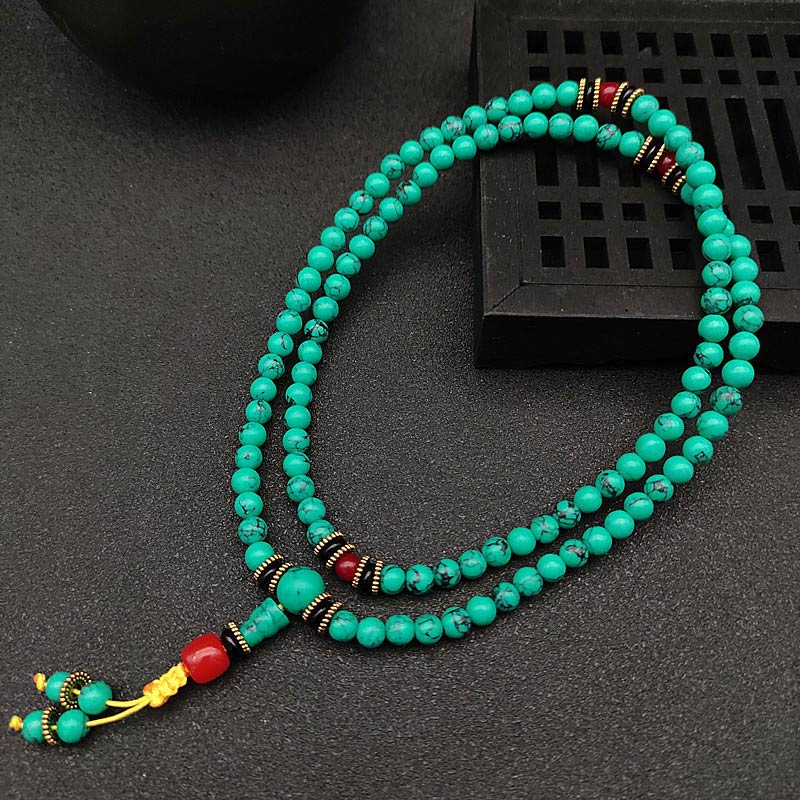 Turquoise prayer beads with red accents for mindfulness and meditation