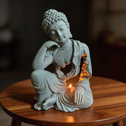 Modern Mindful Buddha Silhouette: Sandstone Sculpture & Ambient Candle Holder