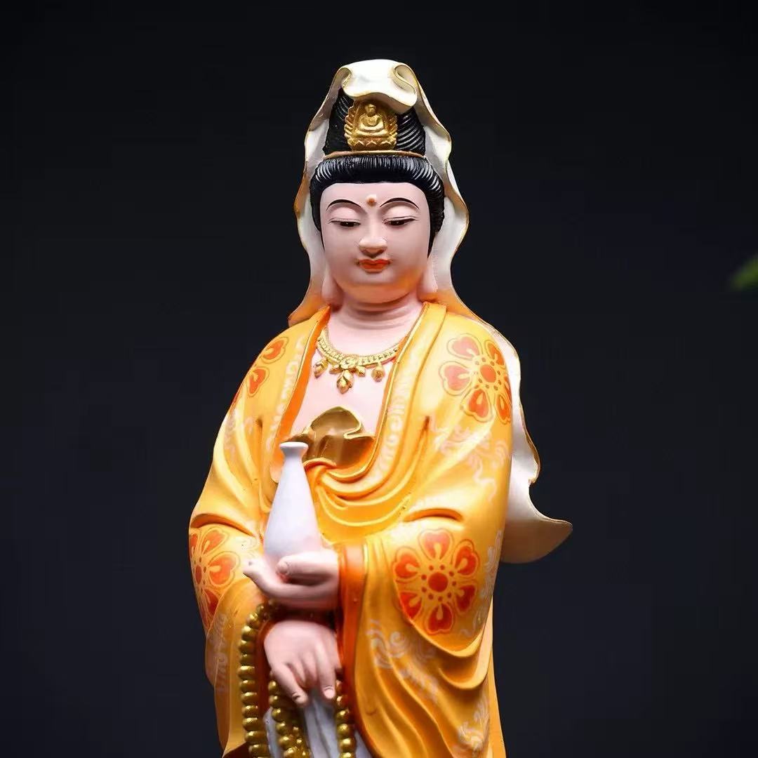 Golden Guanyin Buddha statue holding vase and prayer beads, Buddhist altar decor for mindfulness and peace