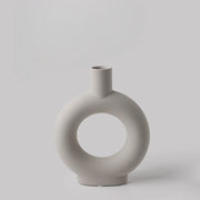 Minimalist ceramic vase with circular cutout, ideal for altar decor or mindfulness spaces