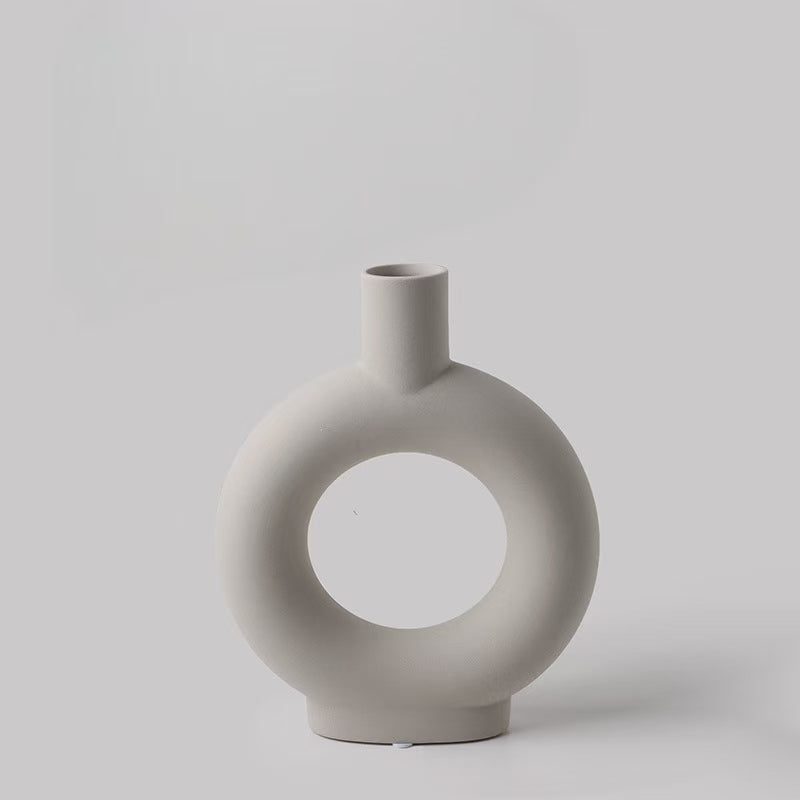 Minimalist ceramic vase with circular cutout, ideal for altar decor or mindfulness spaces