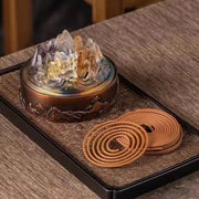 Mountain-shaped glass incense burner with coiled incense sticks, altar decor for mindfulness and peace
