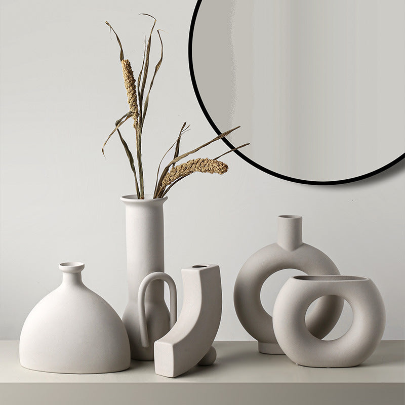 Minimalist ceramic vases with dried grass, modern altar decor for mindful home spaces