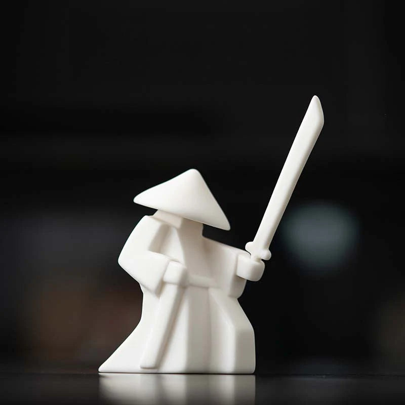 White ceramic Buddhist monk statue holding sword, minimalist altar decor for mindfulness and peace